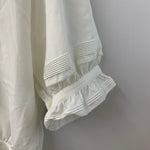 カネコイサオ kaneko isao ワンダフルワールド リボン ブラウス フリル パールボタン 半袖シャツ ホワイト 201LT-434