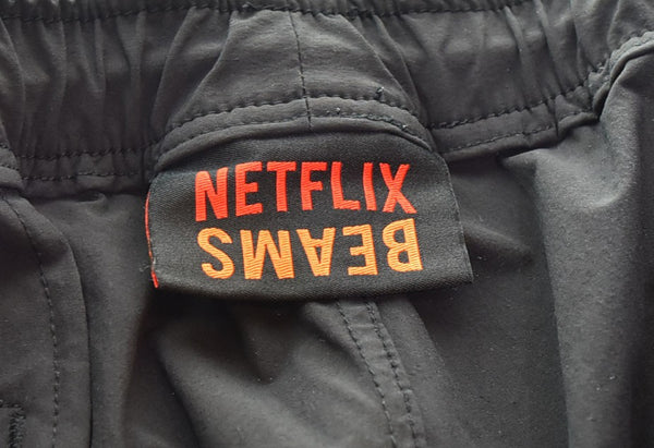 ビームス BEAMS ×NETFLIX Nylon Track Pants ナイロンパンツ トラックパンツ ジョガーパンツ 11-24-3345-803 ボトムスその他 ブラック Lサイズ 103MB-449