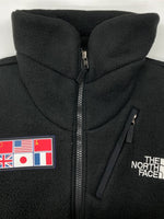 ザノースフェイス THE NORTH FACE TRANS ANTARCTICA FLEECE JACKET トランス アンターティカ フリース ジャケット ジップアップ 国旗 アウトドア 黒 NA72235 ジャケット ロゴ ブラック Mサイズ 104MT-2191